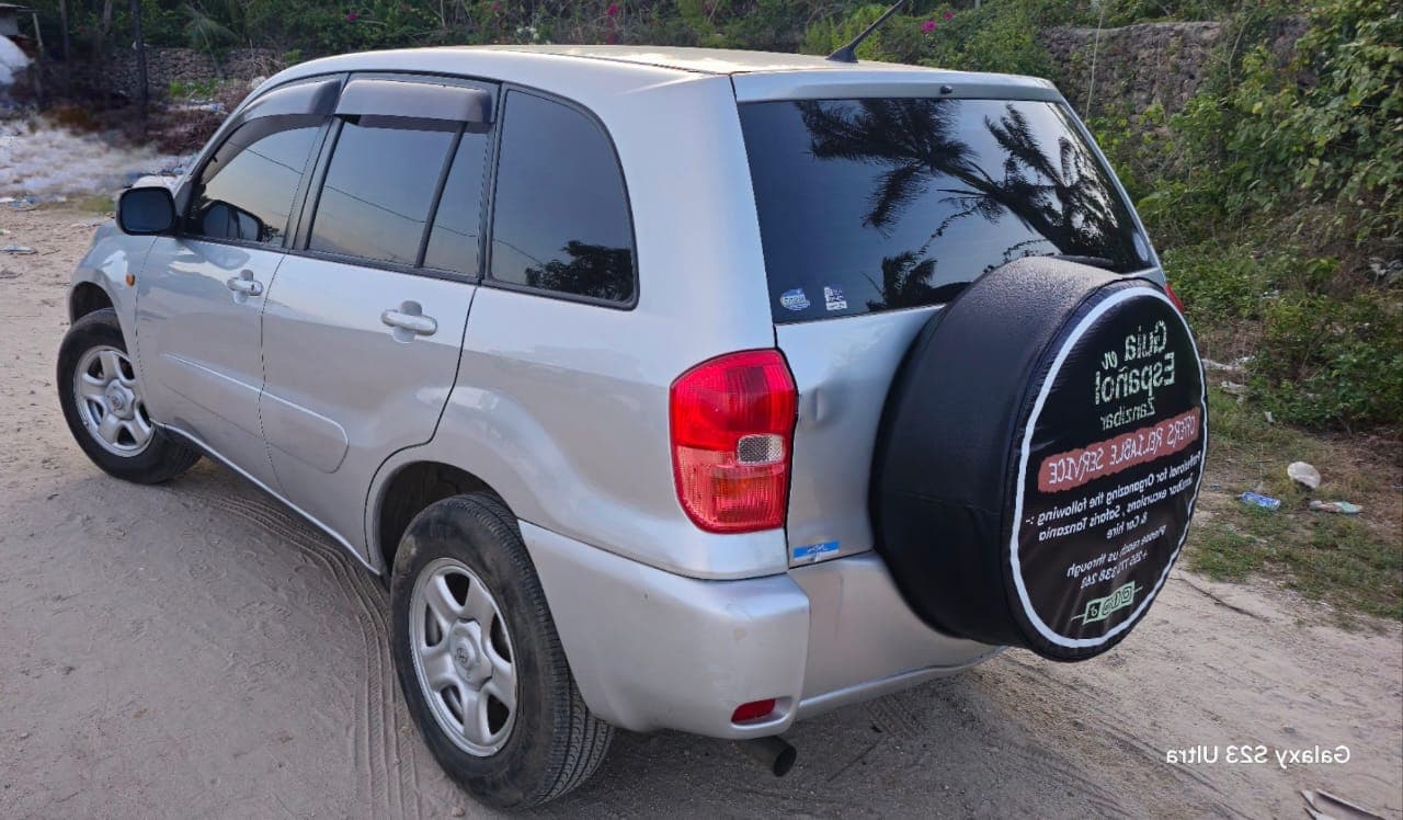 Silver Toyota RAV4 with branding